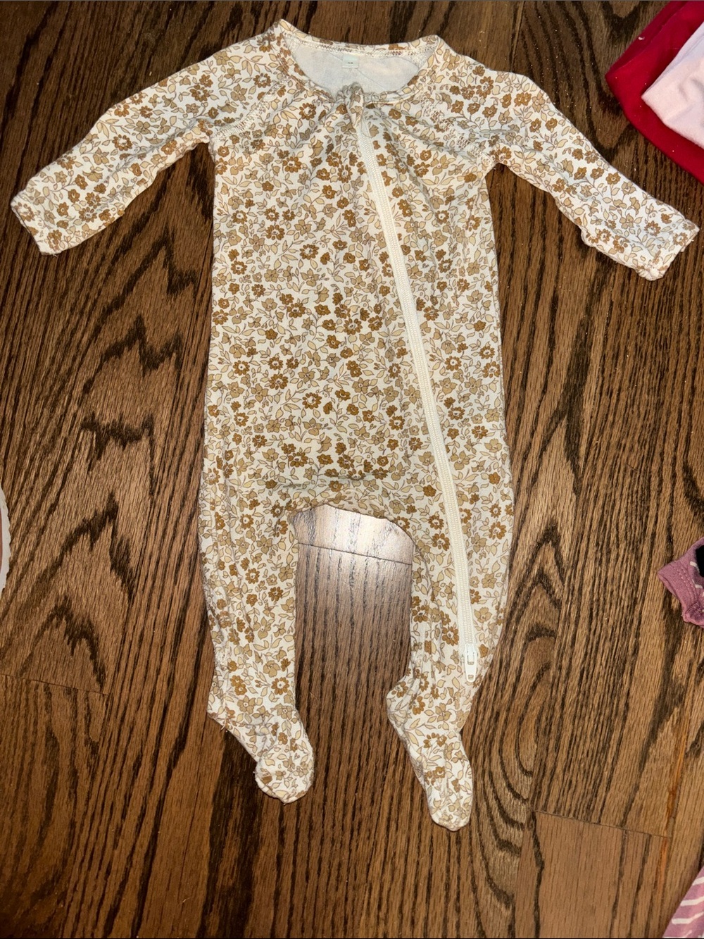Girls Quincy Mae bamboo zip footie in the "Bloom" or "Wildflower" print. NB